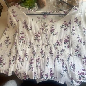 American Eagle top , white w purple flowers.